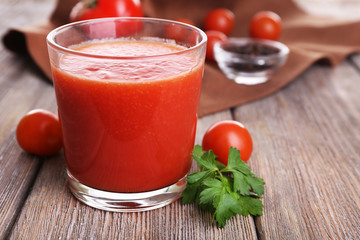 Glass of tomato juice with cherry tomatoes