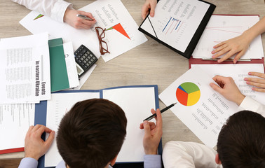 Group of business people working at desk top view