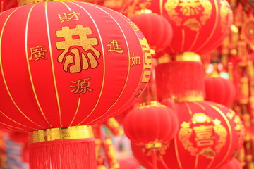chinese red lantern and firecrakers wishing a happy new year