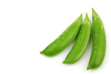 three fresh sugar snaps on a white background