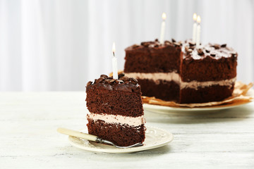 Delicious chocolate cake on table on light background