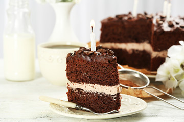 Delicious chocolate cake on table on light background