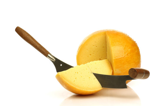 Dutch Edam cheese with a cheese cutter