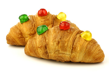 freshly baked croissants bread with colorful conserved fruits