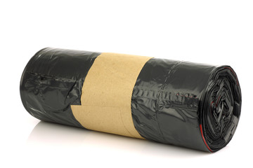 new roll of garbage bags on a white background