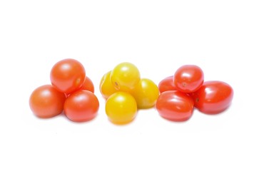 Small cherry tomato on white background close up