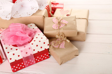 Beautiful gift boxes on wooden background. Valentine Day