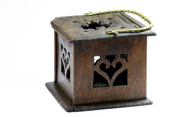 Wooden foot stove with brass handle on a white background