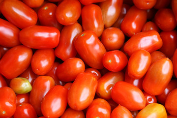 little tomatoes for sale on a market
