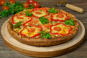 Pizza with chicken and peppers, cherry tomatoes, parsley