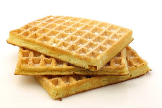 Three Stacked Sugar Waffles On A White Background