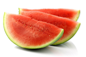 fresh and ripe watermelon pieces on a white background