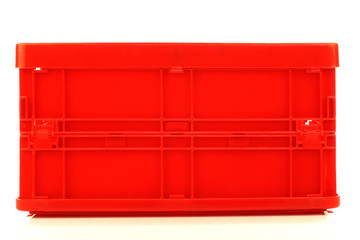  foldable red plastic storage box on a white background