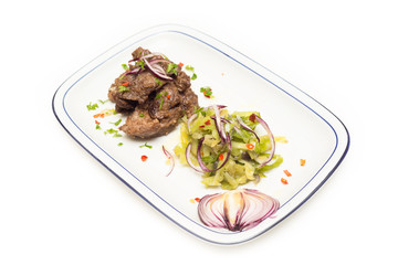 Agnello in salsa con contorno di cavolo e spezie