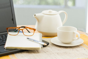 Wooden table with office supplies