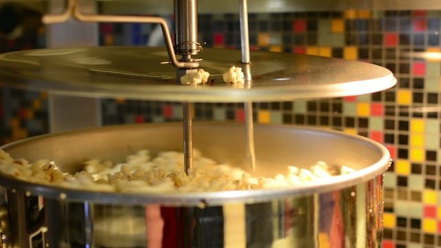 making popcorn in the cinema - machine