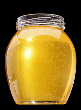 Jar With Honey Isolated On The Black Background