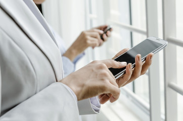 Business people using smart phone