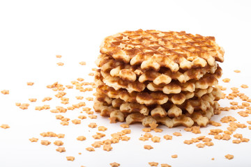 Stack of round waffles on white background with many stars