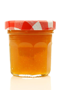 glass jar with fruit jam with room for your label, texr or image