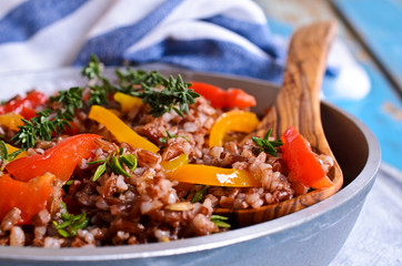 Rice red with paprika and thyme