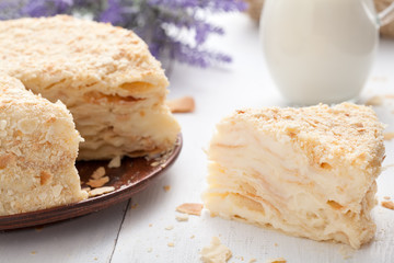 Custard slice cake in vintage provence style background with mil