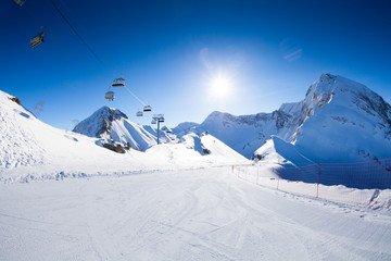 Ski piste panorama with ropeway chair lift