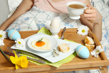 Tray with breakfast on a bed