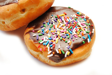 Close-Up of Chocolate Cream Donuts Over White