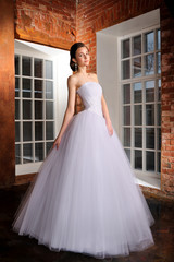 Obraz premium Full-length beautiful Bride in wedding dress. Studio.
