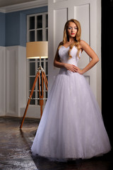 Fototapeta premium Full-length beautiful Bride in wedding dress. Studio.