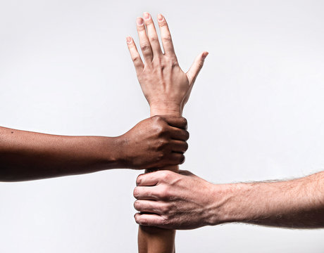 African American and Caucasian hands together world ethnicity