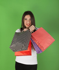 happy young girl after shopping in studio