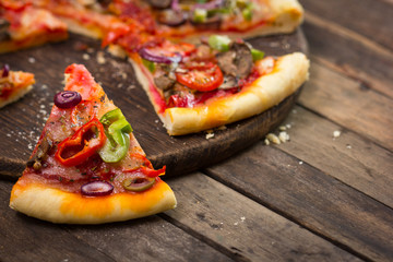 Sliced pizza on the table close up