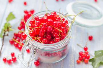 fresh red currant fruit jar wooden table