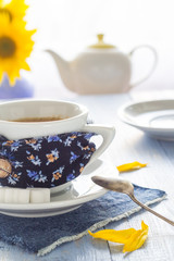 coffee cup black wooden board brown white jug milk sunflower