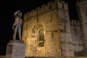View on Lloyd George statue and Caernarfon Castle at night