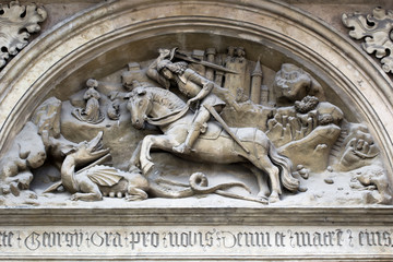 Fototapeta premium Bas-relief of the St George and dragon