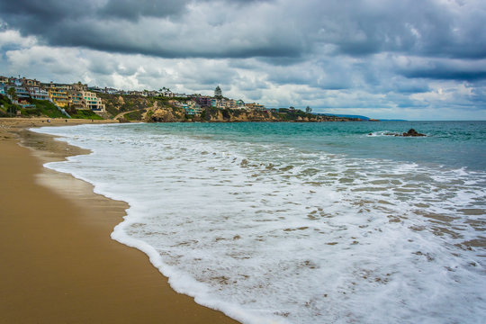 Dark clouds over the Pacific Ocean and cliffs in Corona del Mar,