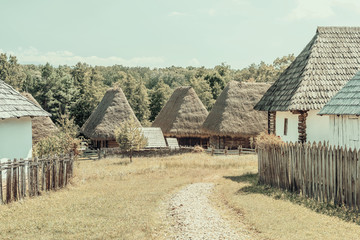 Fototapeta na wymiar Vintage Effect Of Romanian Village In The Carpathian Mountains