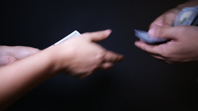 Close up of paying cash