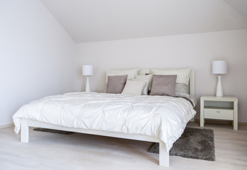 Fototapeta na wymiar Double bed in a modern bedroom