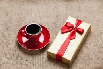Cup of coffee and gift box