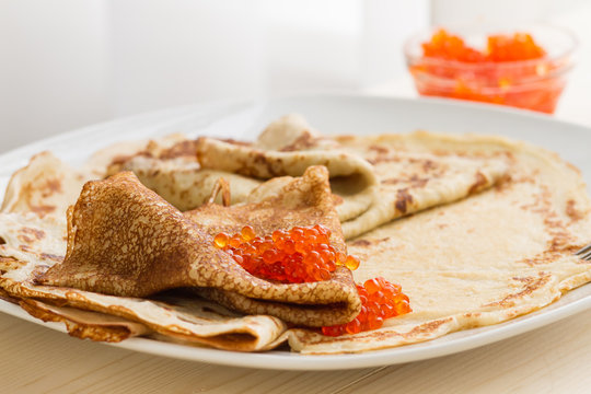 Russian pancakes with red caviar 