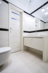 Fototapeta na wymiar Toilet with washbasin in apartment