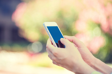 Closeup woman hands holding, using smart, mobile phone