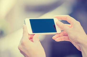Closeup woman hands holding, using smart, mobile phone