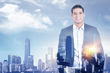 confident business man in suit on city sky line background