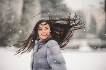 winter portrait of Beauty girl with snow