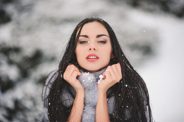 winter portrait of Beauty girl with snow